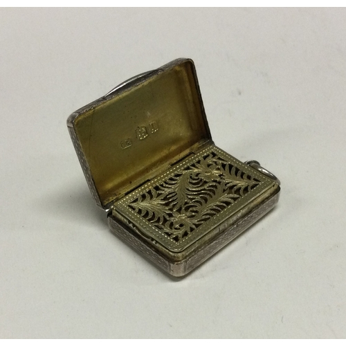 103 - A George III engine turned silver vinaigrette with pierced picture grill to interior. London 1814. B... 