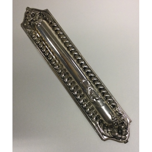13 - A large Judaica silver mezuzah. Approx. 47 grams. Est. £30 - £60.