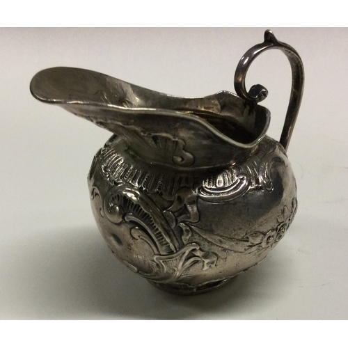 158 - A Victorian silver chased jug. Bearing import marks. Approx. 73 grams. Est. £60 grams. Est. £60 - £8... 