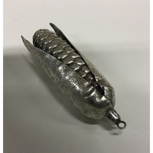20 - A heavy silver model of a corn on the cob. Approx. 68 grams. Est. £50 - £80.