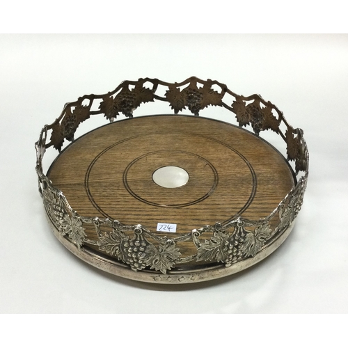 224 - A large pierced Magnum silver wine coaster. Birmingham 1987. By Barrowclift Silvercraft. Est. £250 -... 