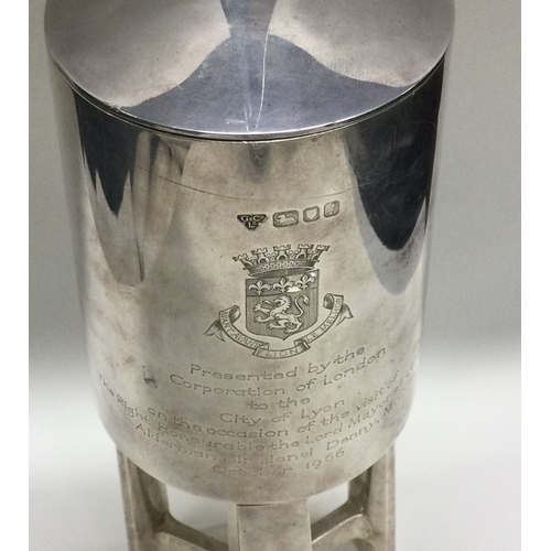 228 - A silver presentation lidded goblet. London 1966. Designed by AG Styles. Retailed by Garrard & Co. A... 