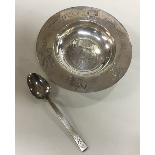 235 - A rare silver christening set with 'Humpty Dumpty' decoration in original case. London 1938. Approx.... 