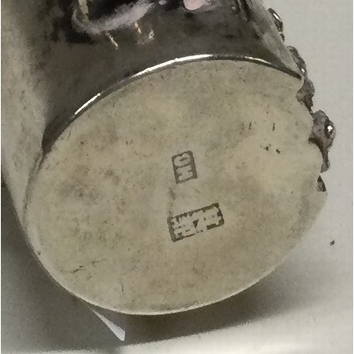 50 - A Chinese silver pepper with chased and hammered decoration. Approx. 45 grams. Est. £80 - £120.