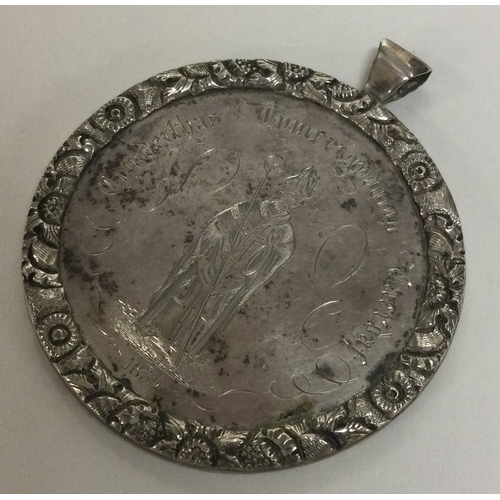 EXETER A good large silver medallion chased with flowers and leaves