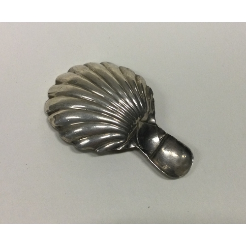 63 - A George III silver caddy spoon with bright cut decoration. Birmingham 1816. By IL. Approx. 4 grams.... 