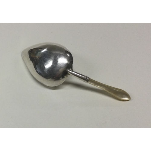 66 - A George III silver and MOP caddy spoon. Birmingham 1806. By William Pugh. Approx. 6 grams. Est. £60... 