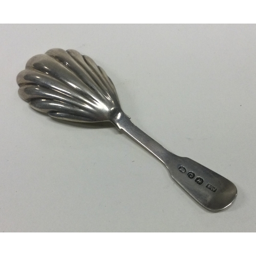 69 - A large silver George III caddy spoon with fluted bowl. London 1820. By James White. Approx. 16 gram... 