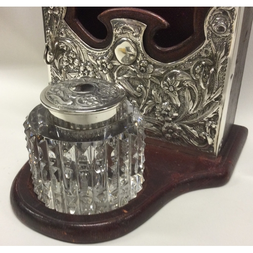 117 - An unusual leather and silver mounted stationery box with floral decoration. London 1897. Est. £100 ... 