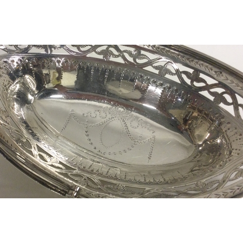 164 - A good Georgian silver boat shaped swing handled basket with bright cut decoration. London 1786. App... 