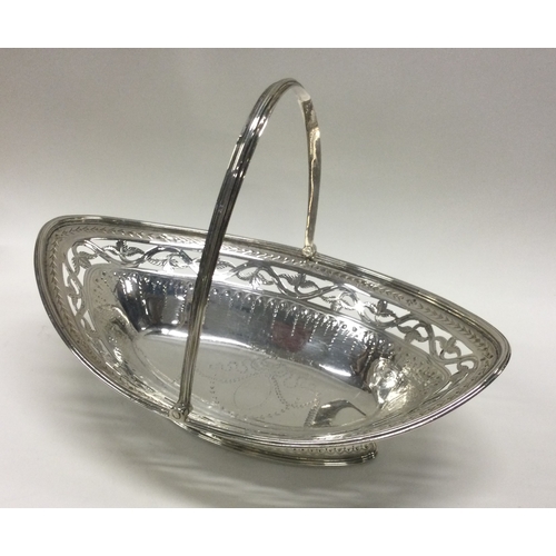 164 - A good Georgian silver boat shaped swing handled basket with bright cut decoration. London 1786. App... 