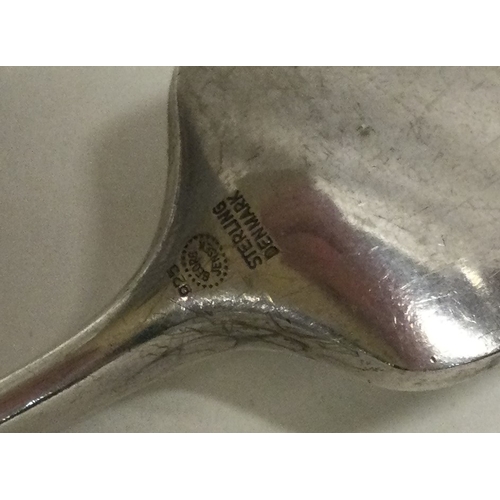 140 - GEORG JENSEN: A silver fork of typical design. Approx. 49 grams. Est. £60 - £80.