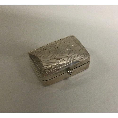 16 - An engraved silver box with hinged top. Est. £8 grams. Est. £20 - £30.