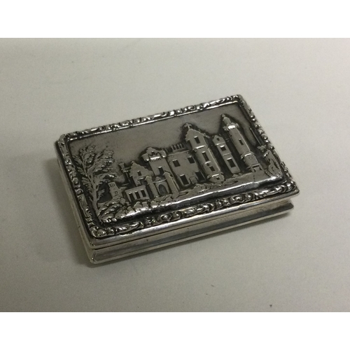 27 - A castle top Victorian silver vinaigrette depicting Windsor Castle. Birmingham 1835. Approx. 34 gram... 