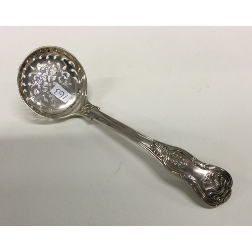 163 - A heavy Kings' pattern silver sifter spoon. London. By HL&HL. Approx. 65 grams. Est. £25 - £35.