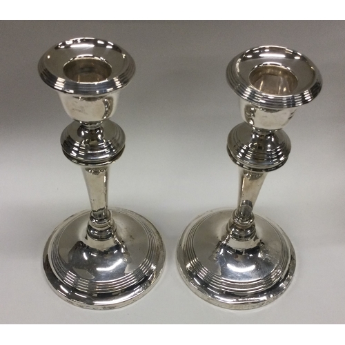 167 - A pair of silver candlesticks. Birmingham 1914. Approx. 347 grams gross. Est. £50 - £80.