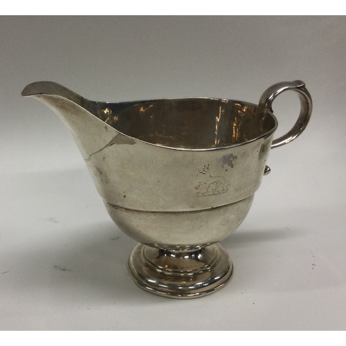 171 - An 18th Century crested silver sauceboat. Possibly Provincial. Approx. 154 grams. Est. £100 - £150.