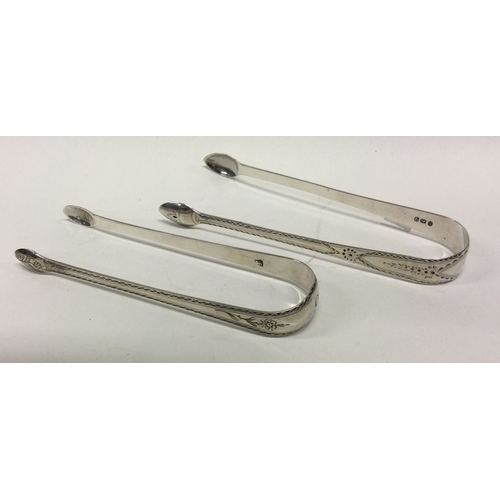 44 - Two pairs of bright cut silver sugar tongs. London. Approx. 58 grams. Est. £35 - £45.