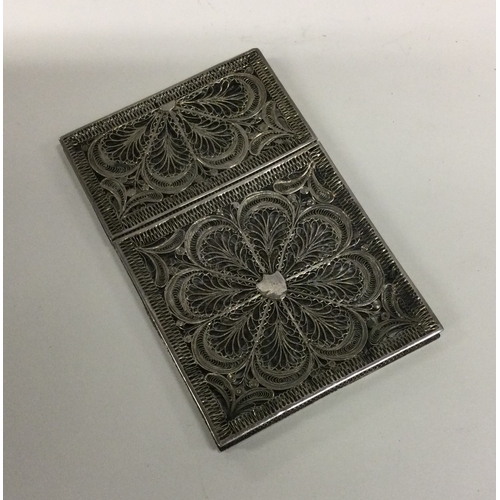 46 - A pierced silver filigree card case. Approx. 51 grams. Est. £150 - £200.