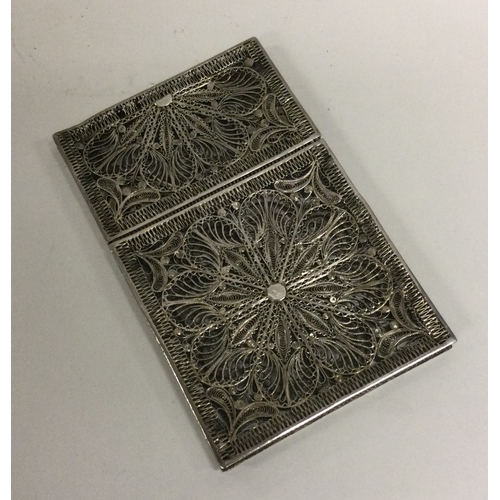 46 - A pierced silver filigree card case. Approx. 51 grams. Est. £150 - £200.