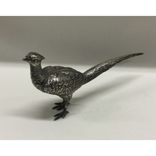 52 - A large silver figure of a bird bearing import marks. Est. £61 grams. Est. £150 - £200.