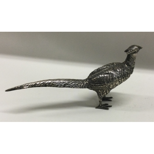 52 - A large silver figure of a bird bearing import marks. Est. £61 grams. Est. £150 - £200.