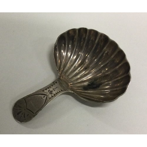 54 - A George III silver caddy spoon with fluted bowl. London 1802. By Duncan Urquhart & Naphtali Hart. A... 