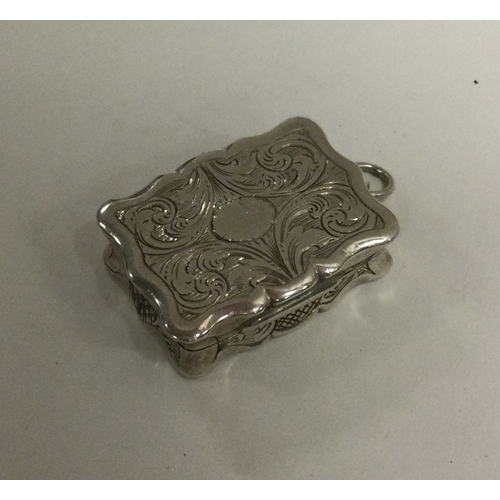 55 - An engraved silver vinaigrette. Birmingham 1865. By Hilliard & Thompson. Approx. 14 grams. Est. £140... 