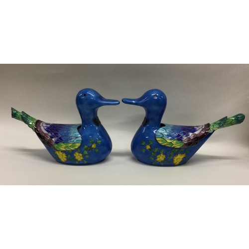 62 - A pair of silver and enamel sauce boats in the form of ducks together with matching spoons forming p... 