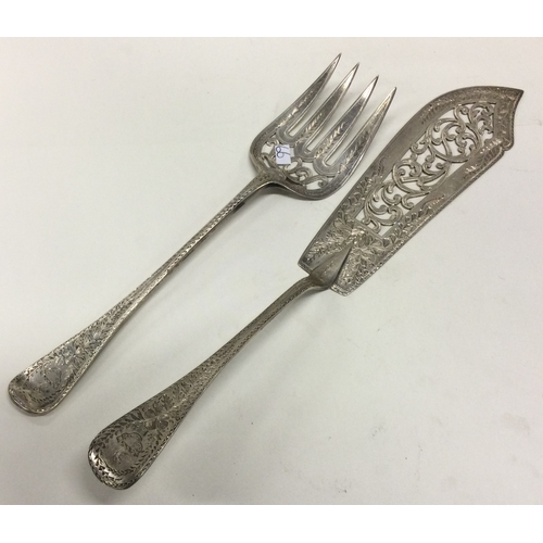 66 - A heavy pair of Victorian silver servers. London 1873. By George Adams. Approx. 249 grams. Est. £300... 