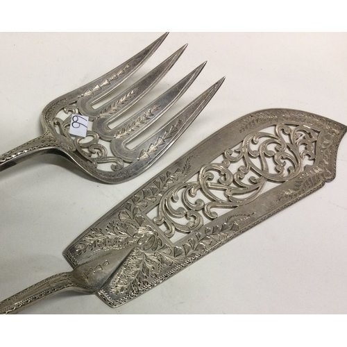 66 - A heavy pair of Victorian silver servers. London 1873. By George Adams. Approx. 249 grams. Est. £300... 