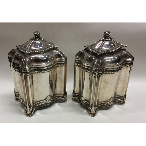 119 - A good pair of 18th Century George III silver tea caddies. London 1780. By Lewis Hamon. Approx. 501 ... 