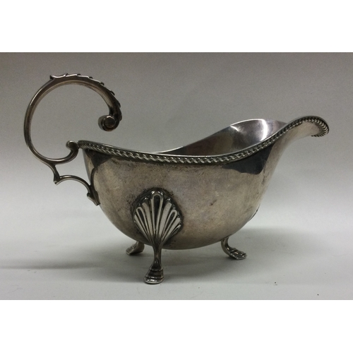 123 - An Edwardian silver sauce boat with gadroon rim. Birmingham. by WN. Approx. 163 grams. Est. £80 - £1... 