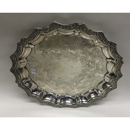 139 - A good circular silver waiter decorated with flowers. Sheffield. Approx. 350 grams. Est. £100 - £150... 