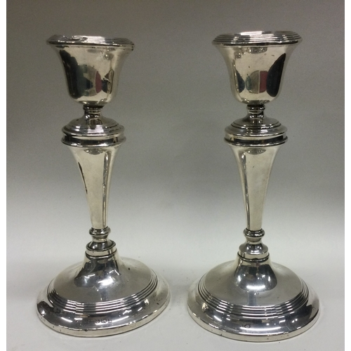 142 - A tall pair of silver candlesticks with reeded decoration. Birmingham. By WA. Approx. 500 grams gros... 