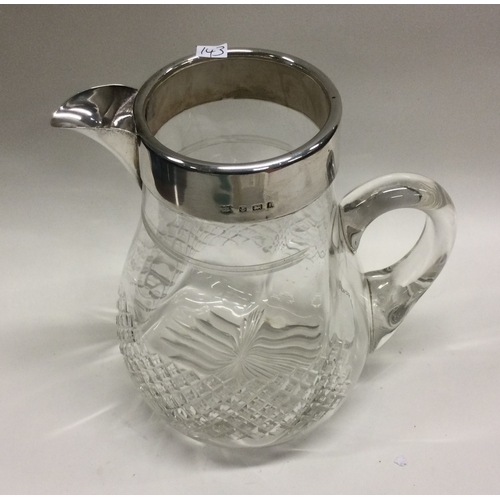 143 - A silver mounted cut glass lemonade jug. Birmingham. Est. £50 - £80.