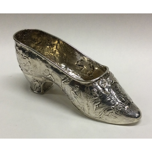 164 - A good Victorian silver model of a shoe with chased decoration. Birmingham 1903. By Edwin Bryant. Ap... 