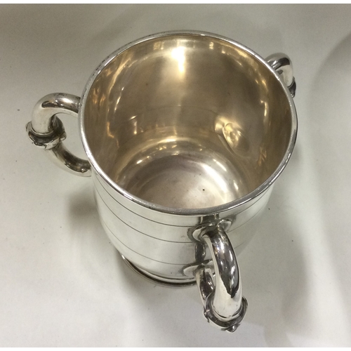 167 - A rare Victorian silver tyg. London 1872. By Robert Garrard. Approx. 194 grams. Est. £400 - £500.