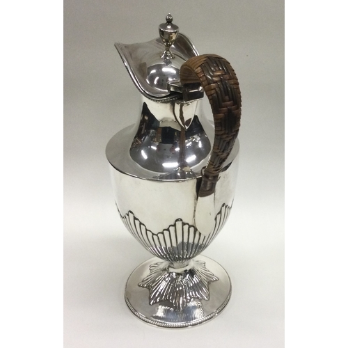 188 - A good silver half fluted ewer with wicker handle. Birmingham. Approx. 245 grams. Est. £100 - £150.