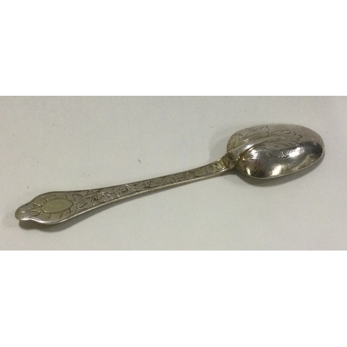 193 - A 17th Century dog nose silver spoon attractively decorated with scrolls. Circa 1695. Approx. 9 gram... 