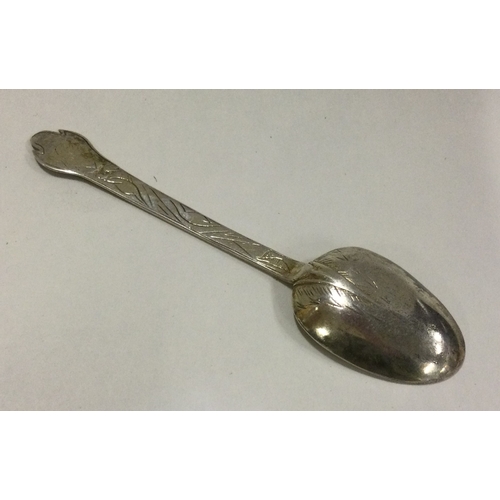 194 - A 17th Century dog nose silver spoon attractively decorated with scrolls. Circa 1695. Approx. 9 gram... 