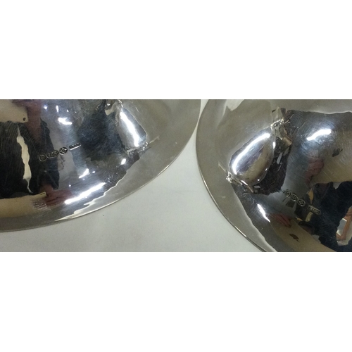 209 - GEORG JENSEN: A heavy pair of Danish silver bowls. Approx. 240 grams. Est. £500 - £800.