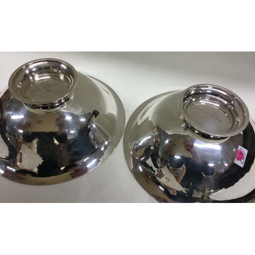 209 - GEORG JENSEN: A heavy pair of Danish silver bowls. Approx. 240 grams. Est. £500 - £800.