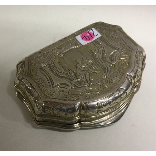 214 - An 18th Century French silver hinged snuff box with chased decoration. Marked to interior. Approx. 8... 