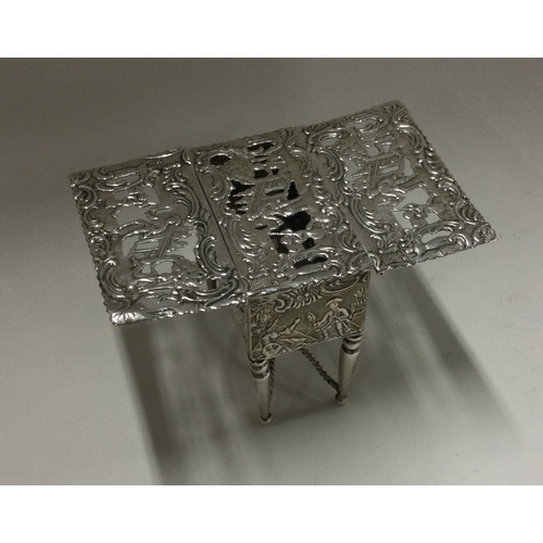 228 - A German silver box in the form of a table with hinged top. London. By L&L. Approx. 86 grams. Est. £... 