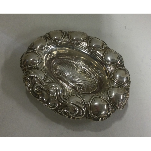 235 - A small silver dish with shell decoration. Birmingham. Approx. 21 grams. Est. £25 - £35.