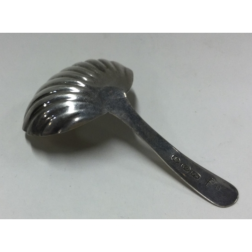 245 - A large George III silver caddy spoon. London 1816. By HN. Approx. 13 grams. Est. £35 - £45.