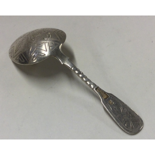 248 - A Russian silver bright cut caddy spoon. Approx. 20 grams. Est. £50 - £80.