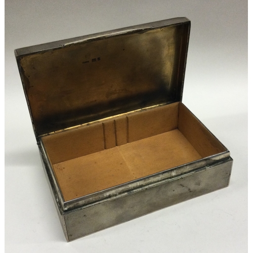 254 - An engine turned silver hinged top cigarette box. London. By Asprey & Co. Approx. 343 grams. Est. £5... 