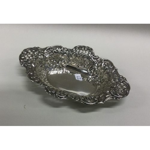 27 - An Edwardian chased silver bonbon dish. Birmingham. Approx. 42 grams. Est. £20 - £30.